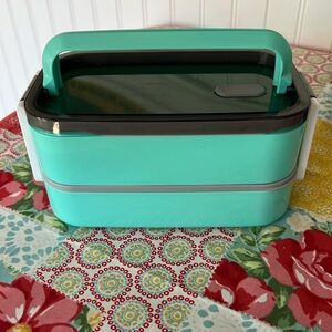 This is a lunch kit with a bento box a thermos, and a lunch bag.